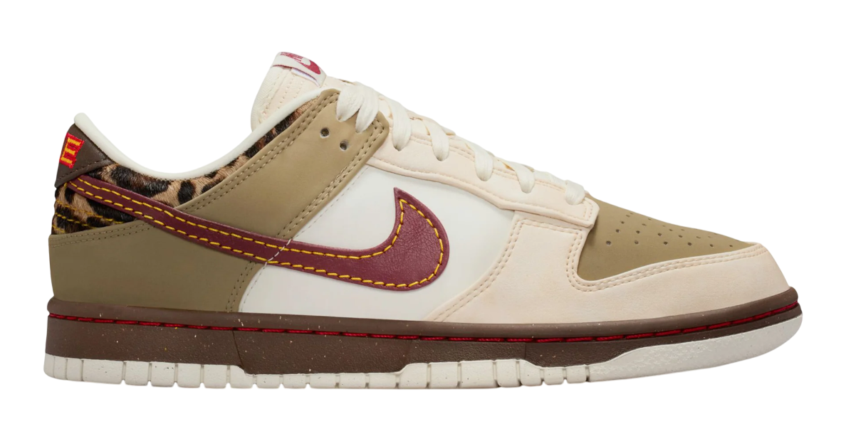 Beige and white sneaker with red accents on a white background