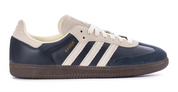 Navy and white Adidas sneaker on a white background