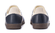 Navy and beige shoes on a white background