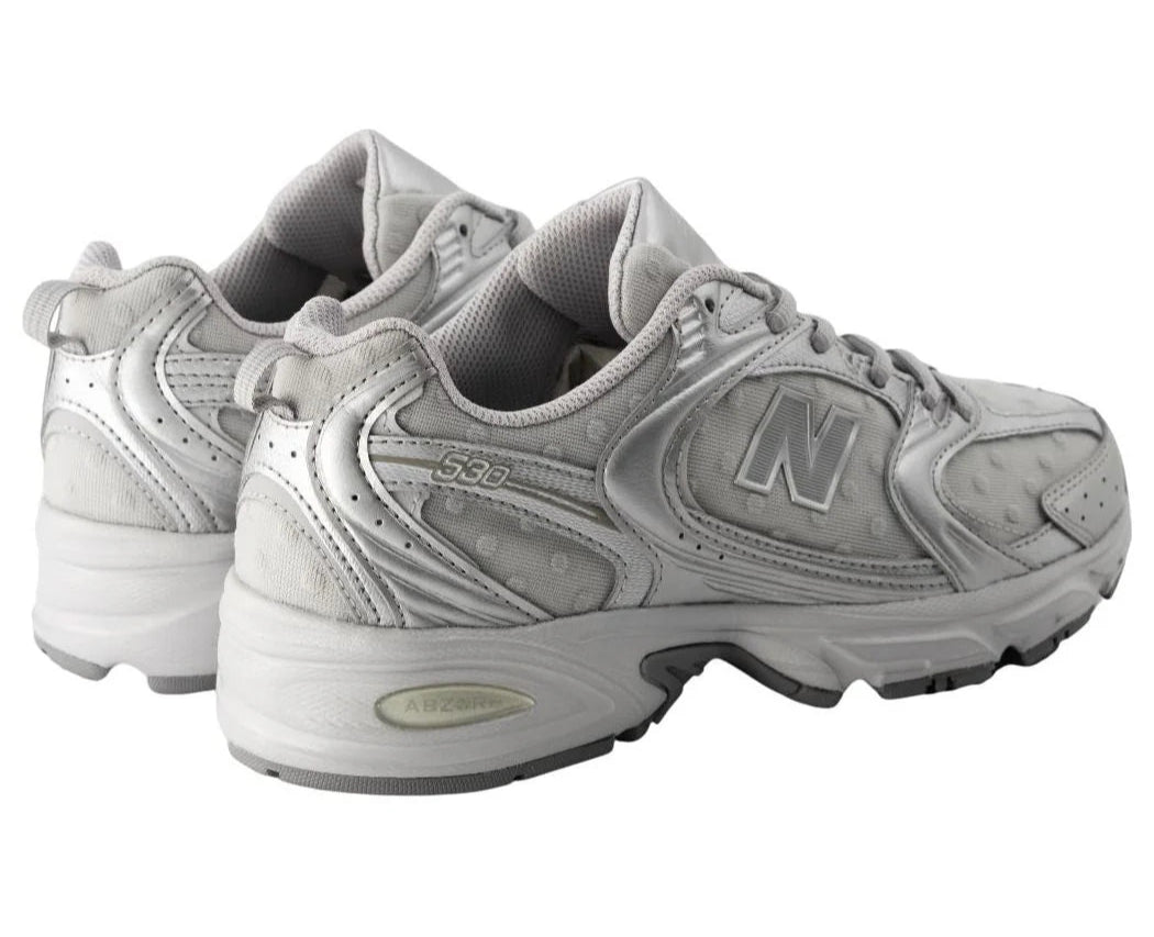 Pair of gray New Balance sneakers on a white background