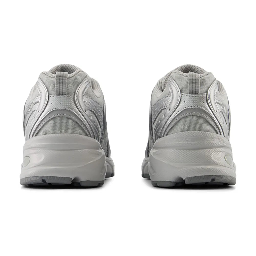 Gray athletic shoes shown from the back on a white background