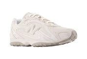 White sneaker with New Balance logo on a white background