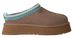 Brown slipper with a blue and white crocheted trim on a white background - Image 1
