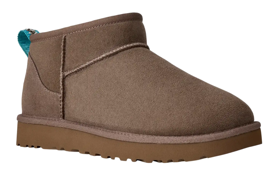 Brown suede ankle boot on a white background