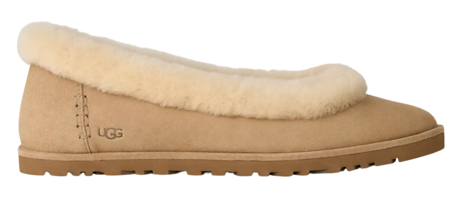Beige UGG slipper with fluffy trim on a white background