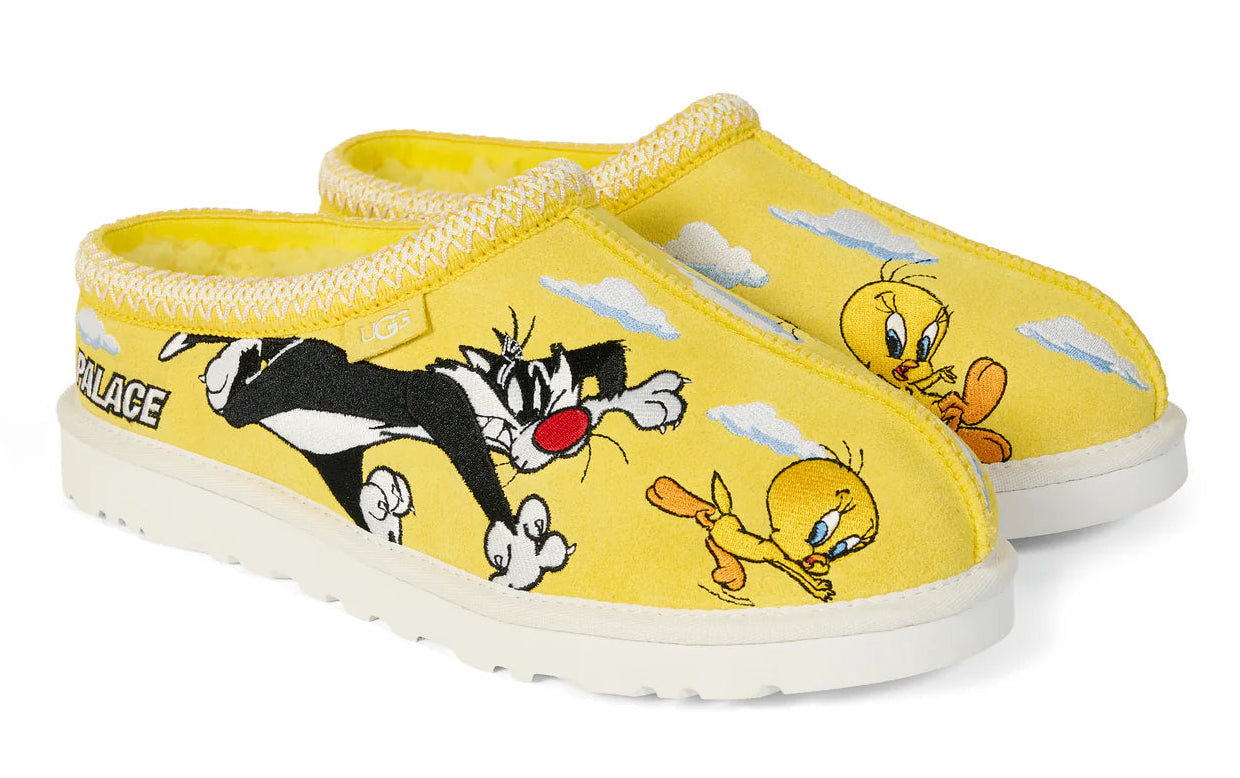 Yellow slippers with cartoon characters on a white background