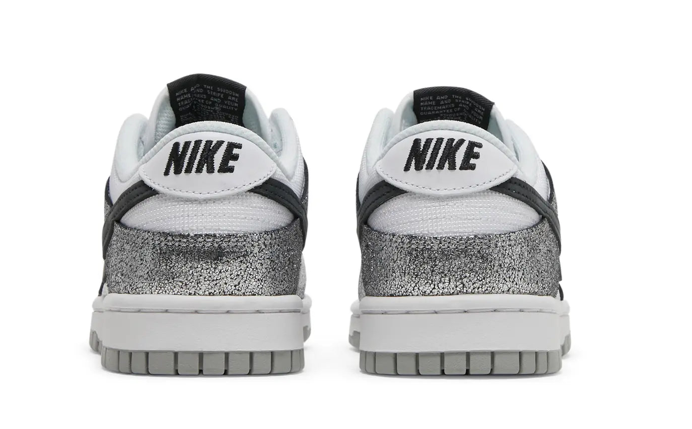 Pair of Nike sneakers with a white sole on a white background