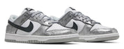 Silver glitter sneakers with black swoosh logo on a white background