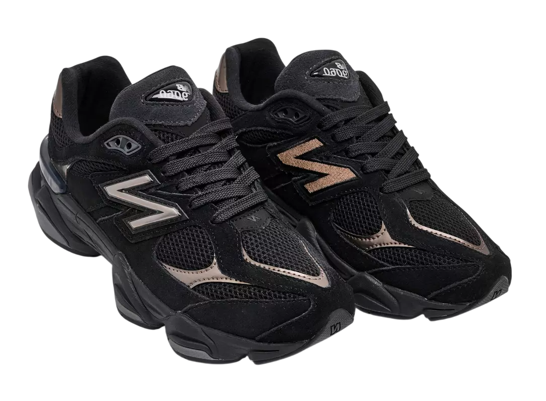 Pair of black athletic shoes with brand logo on a white background