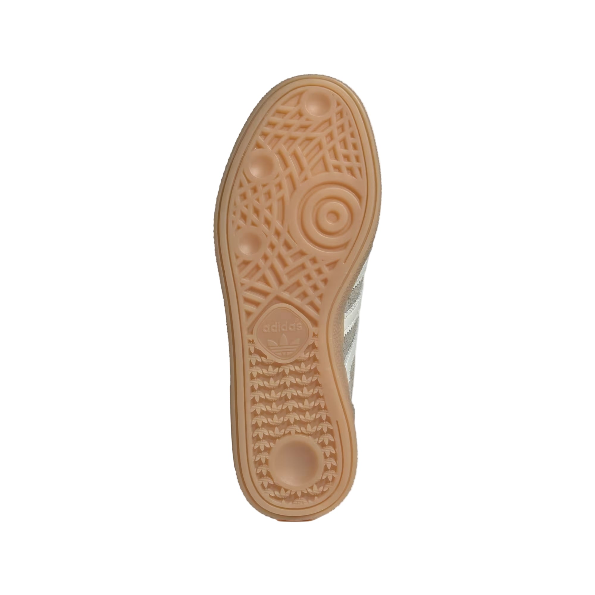 Close-up of a shoe sole with a textured pattern on a light gray background