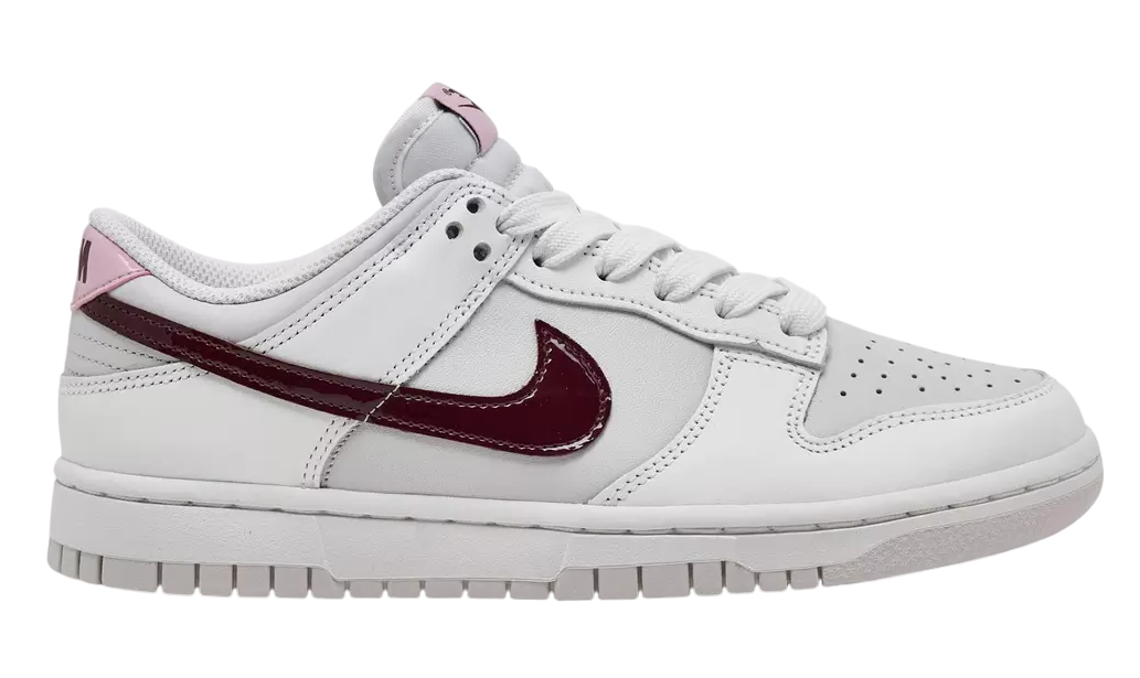 White sneaker with a maroon swoosh logo on a white background