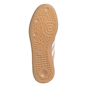 Close-up of a shoe sole with tread pattern on a white background