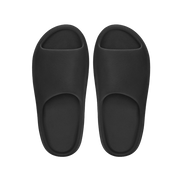 Pair of black slippers on a white background