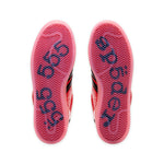 Close-up of red and black athletic shoes with brand logo on sole against a white background - Image 5