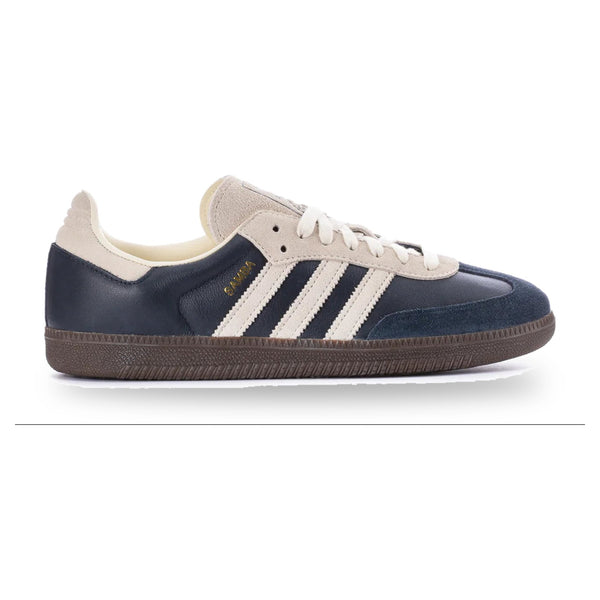 Navy and white Adidas sneaker on a white background