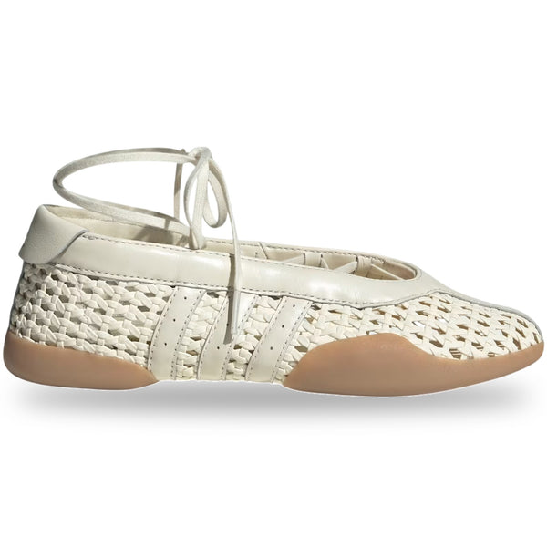 White woven shoe with tan insole on a white background