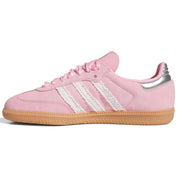 Pink Adidas sneaker with white stripes on a white background
