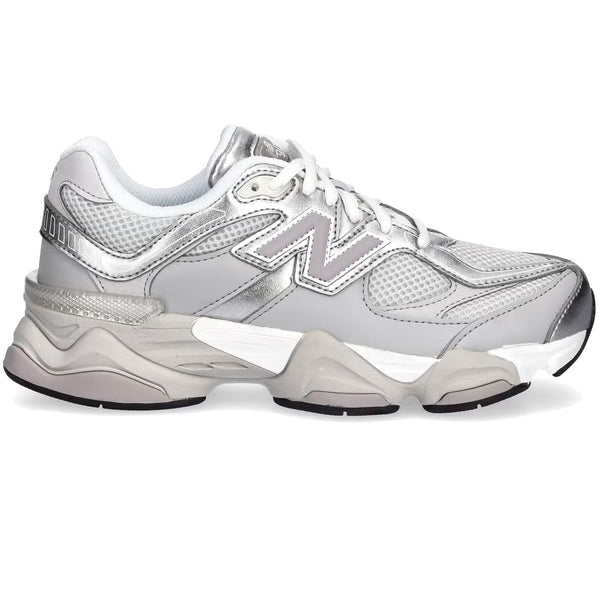 White sneakers with brand logo on a white background